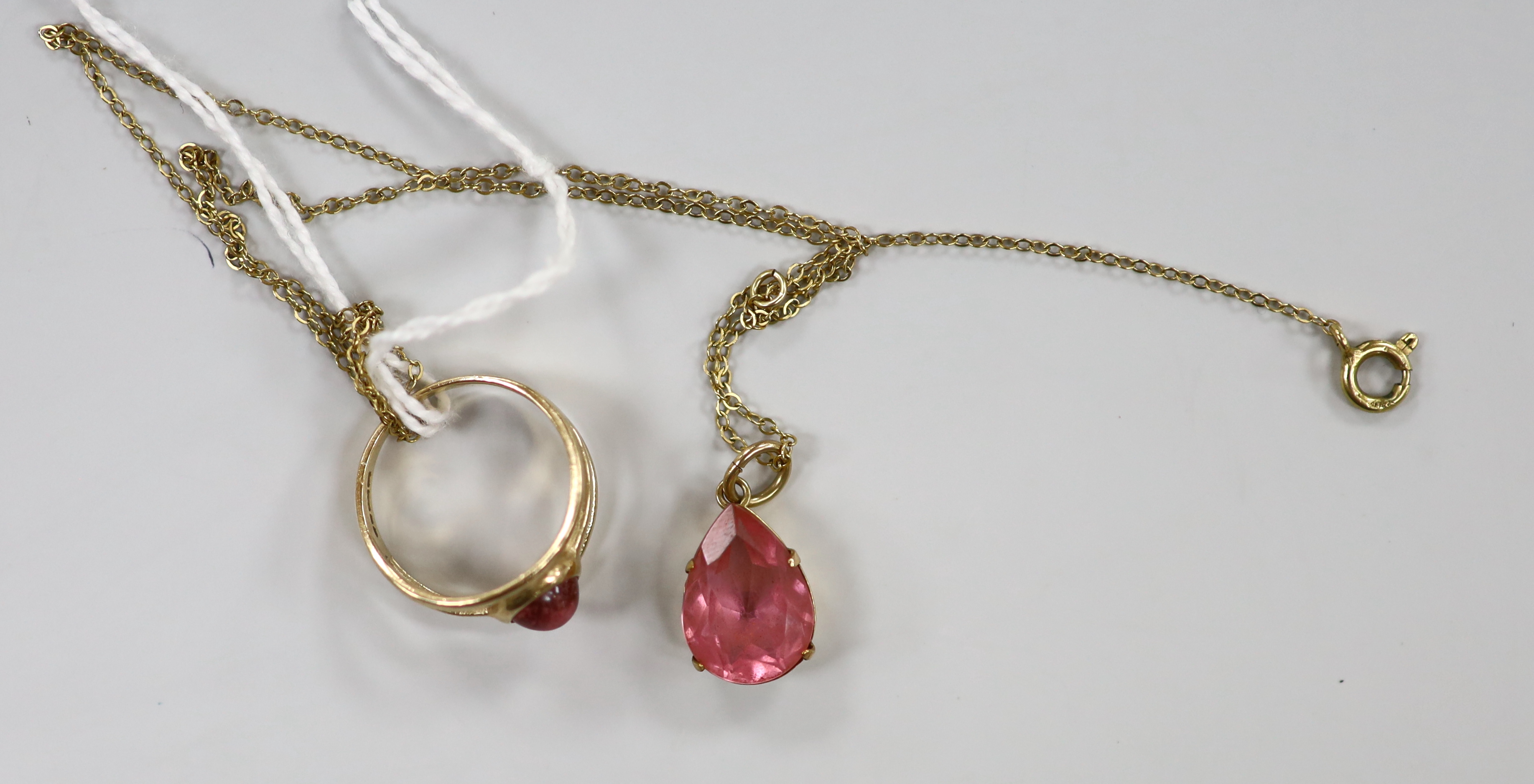 A modern 9ct gold and pink cabochon set ring, size K, together with a yellow metal and pear shaped pink stone set pendant necklace, gross weight 4.8 grams.